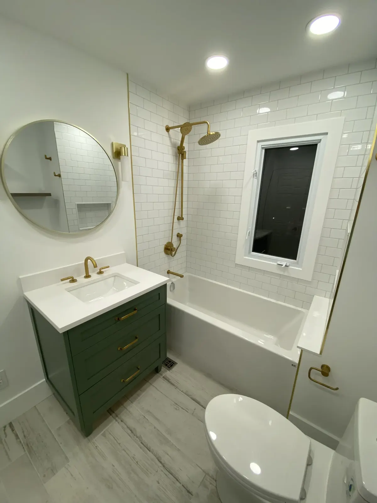 Green vanity with brushed gold fixtures