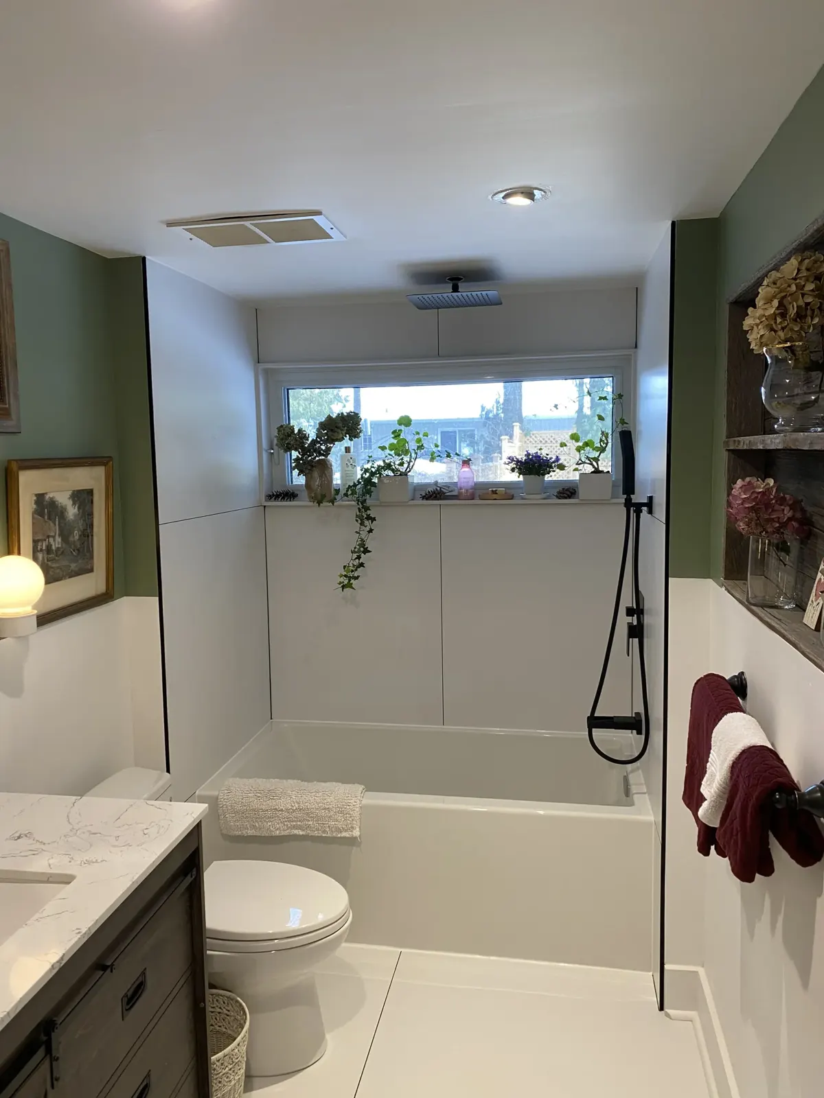 Sage bathroom with a deep soaker tub